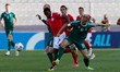 Joseph Mbong (center) of Malta plays against Klaudijus Upstas of Lithuania during the FIFA...