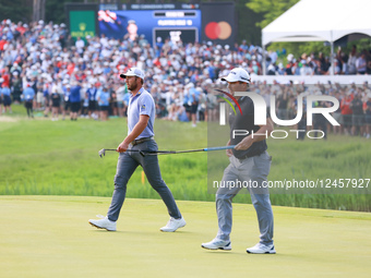 CALEDON, ONTARIO - JUNE 08: Ryan Fox of New Zealand and Sam Burns of the United States walk off the 18th green to return to the tee for anot... by Amy Lemus/NurPhoto