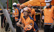 Fire authorities compile and organize incident data on a situation board during a press br...