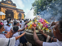 Buddhist devotees participate in meditation and perform meritorious deeds during the Poson Poya Festival at the Kelaniya Buddhist Temple in...