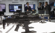 A number of assault rifles are displayed during the Indo Defence 2025 Exhibition in Jakart...