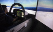 Visitors try out an F15EX jet fighter simulator at the USA's pavilion during the Indo Defe...