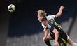Andri Gudjohnsen of Iceland and John Souttar of Scotland vie for the ball during an Intern...