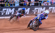 Dan Bewley (99) of Great Britain in white rides inside Fredrik Lindgren (66) of Sweden in...