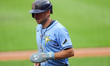 Tampa Bay Rays' Brandon Lowe (8) scores during the fourth inning of the baseball game agai...