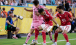 Ahmed Koka and Mohamed Ali Ben Romdhane of Al Ahly battle for possession with Federico Red...