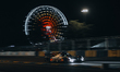 Cadillac Hertz Team Jota #12 speeds through the night under the glow of the Ferris wheel a...