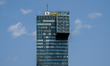 The logo of Ernst & Young Global Limited (EY) is on the top of the IZD Tower building in V...