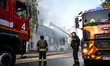 Firefighters suppress a fire in a building caused by a Russian drone strike in Zaporizhzhi...