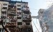 A Russian missile strike causes the collapse of a section of an apartment building in the...