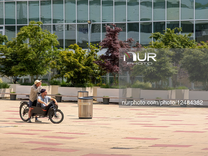 Two Men On Cargo Bike Enjoying Leisure Time In Vienna
