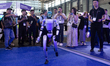 A Unitree Robotics humanoid robot runs at the Shanghai New International Expo Centre in Sh...