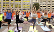 People participate in a yoga mass class to celebrate the annual International Yoga Day at...