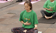 A woman participates in a yoga mass class to celebrate the annual International Yoga Day a...
