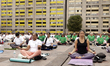 People participate in a yoga mass class to celebrate the annual International Yoga Day at...
