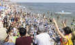 A crowd watches the annual Mermaid Parade in Brooklyn, NYC, USA, on June 21, 2025. The par...