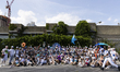 People pose for photographs after participating in the 43rd annual Mermaid Parade in the C...