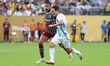Juan Freytes #22 of Fluminense FC and Um Wonsang #11 of Ulsan HD FC battle for the ball du...