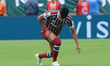 Gabriel Fuentes #12 of Fluminense FC grabs his thigh after a play during the FIFA Club Wor...