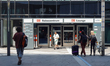 Travelers walk toward the DB Reisezentrum and DB Lounge entrance at a Deutsche Bahn servic...