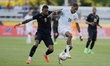 Joseph Rosales #8 of Honduras and Jearl Margaritha #16 of Curacao battle for the ball duri...