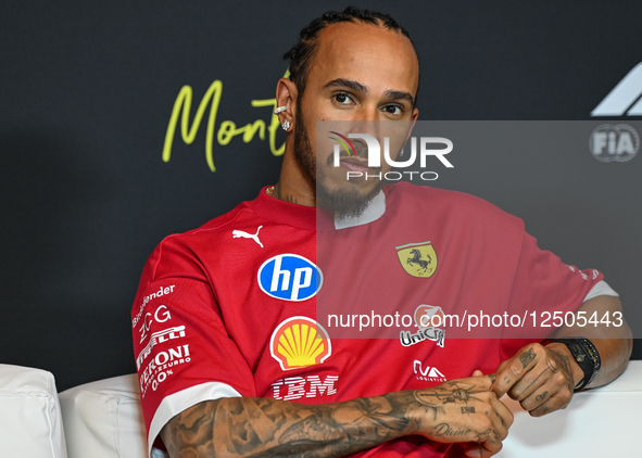 MONTREAL, CANADA - JUNE 12: Lewis Hamilton of Great Britain and Scuderia Ferrari during the press conference on preview day for the Formula...