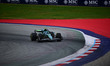 Fernando Alonso of the Aston Martin Cognizant F1 Team drives during free practice in the 1...
