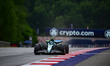 Fernando Alonso of the Aston Martin Cognizant F1 Team drives during free practice in the 1...