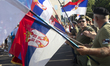 War veterans hold Serbian flags at Slavija Square in Belgrade, Serbia, on June 28, 2025. T...