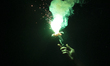 A protester holds a flare at Slavia Square in Belgrade, Serbia, on June 28, 2025. The day...