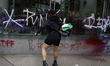 Members of the Black Anarchist Bloc carry out direct action against establishments in the...