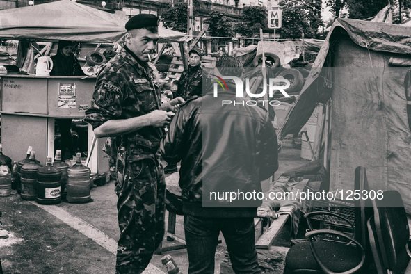 Ukraine - Kyiv - 07 May 2014 - Soldier of the new people's army guarding check point on Maidan place in Kiev. 