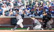 New York Yankees' Anthony Volpe (11) hits a solo home run during the seventh inning of the...