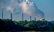 Pollution rises from the stacks of the Miami Fort Power Station, which is situated along t...