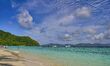 A view of the emerald sea and colorful sky at Racha Yai dive spot in Phuket, Thailand, on...
