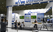 Visitors experience autonomous driving technology at KAI's exhibition booth during the 202...