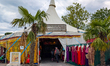 People attend the Summer Tollwood Festival with food stalls, gift stands, and beer garden...