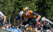 Cyclists compete in the CROSS-COUNTRY SHORT TRACK Men Elite during the UCI Mountain Bike W...