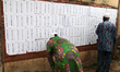 Voters search for their names as Lagos State conducts an election for its 20 Local Governm...