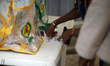 A woman votes as Lagos State conducts an election for its 20 Local Government Areas (LGAs)...