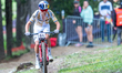 Cyclists compete in the CROSS-COUNTRY OLYMPIC for Men during the UCI Mountain Bike World C...
