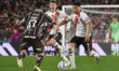 Maximiliano Salas of River Plate competes for the ball with Ignacio Vazquez of Platense du...