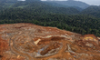 Excavators gather soil containing nickel ore at a mining site operated by PT Hengjaya Mine...