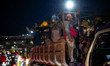 Employees are in traffic during the working shift change near Indonesia Morowali Industria...