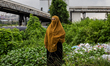 Risma, 33, Headmaster of Madrasah Tsanawiyah Al Jaariyah, poses for a photo outside her sc...