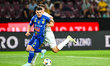 Ionut Dinu and Marko Gjorgjievski play during the match between CFR Cluj and Unirea Sloboz...