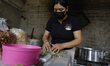 A worker at a workshop makes palanquetas and produces candied candy in Santa Cruz Acalpixc...