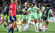 A player and staff of Italy celebrate after victory in Geneva, Switzerland, on July 16, 20...