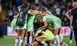 A player and staff of Italy celebrate after victory in Geneva, Switzerland, on July 16, 20...