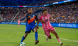 Cincinnati defender Alvas Powell and Miami midfielder Telco Segovia compete for the ball d...